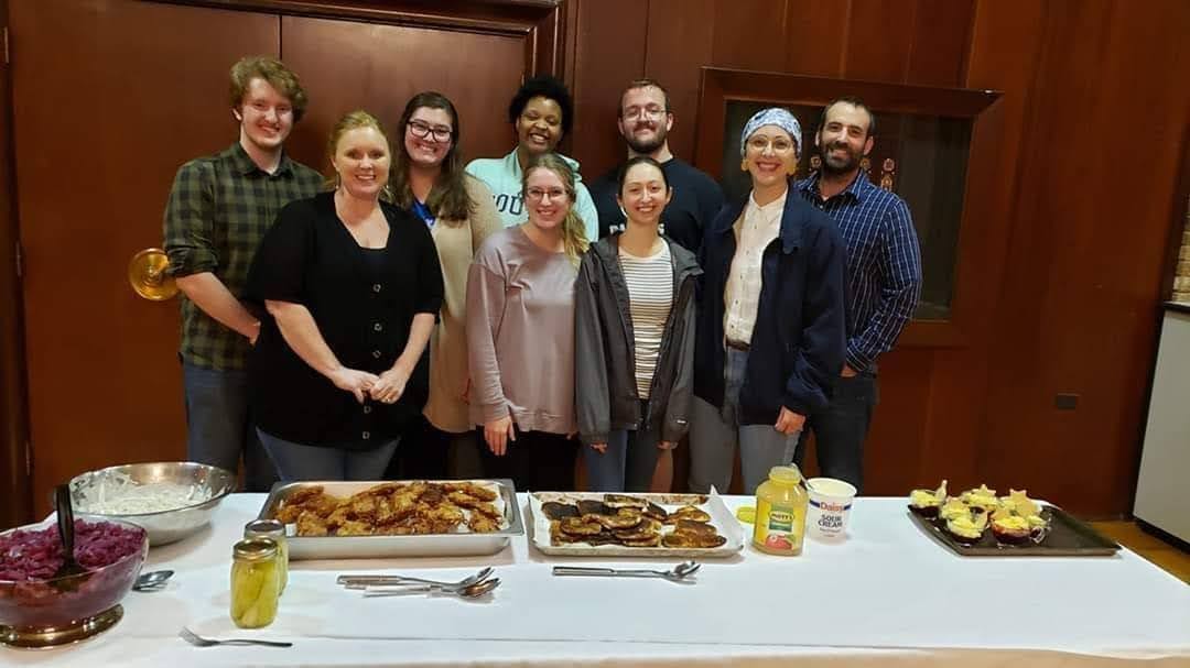 Jewish and Holocaust Studies students in front of class with food prepared