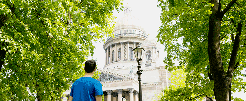 Student in Russia looking at a building.