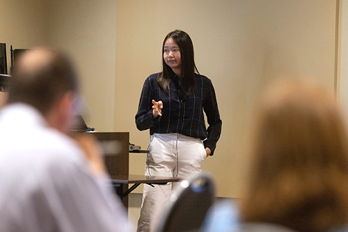 Natthida Tongluan, who was awarded Outstanding Young Scientist, presents at the symposium.