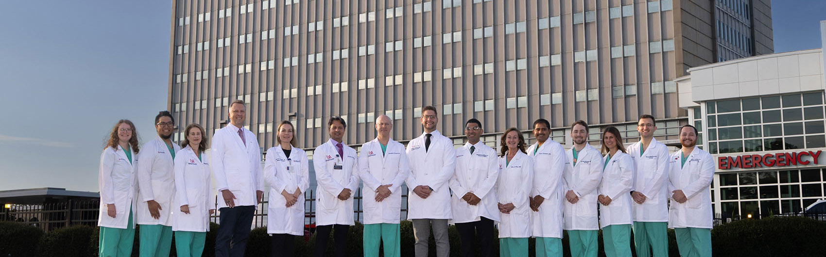 Faculty and residents with the Urology Residency Program stand in front of USA Health University Hospital.