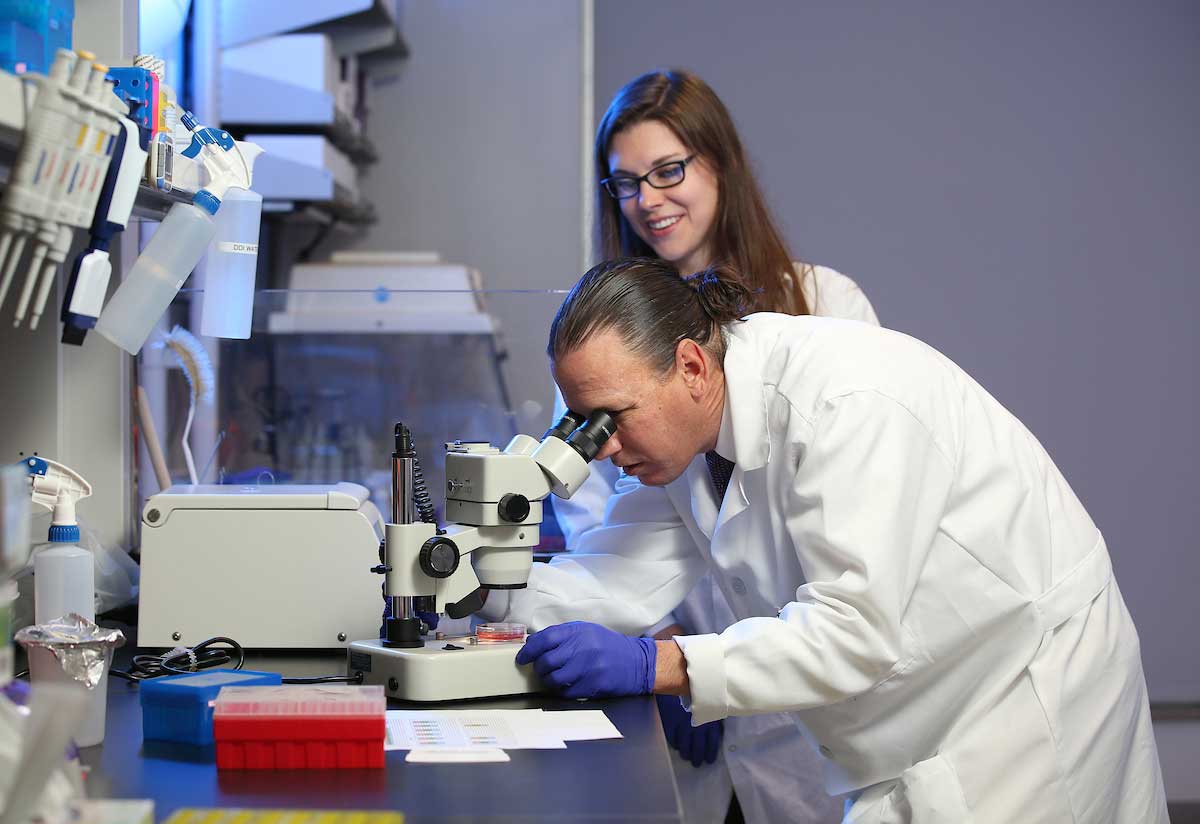 Photo of Dr. Macaluso and BMS student in the lab