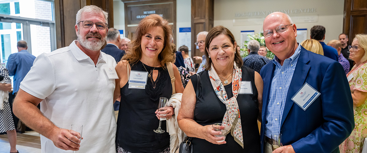 Four College of Medicine Alumni Members in the McQueen Center.