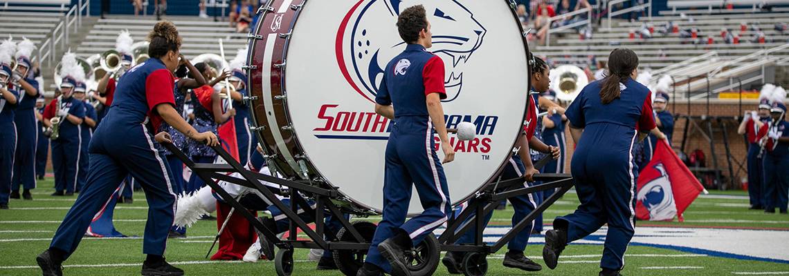 Jaguar Marching Band on the Field with Bass Drum