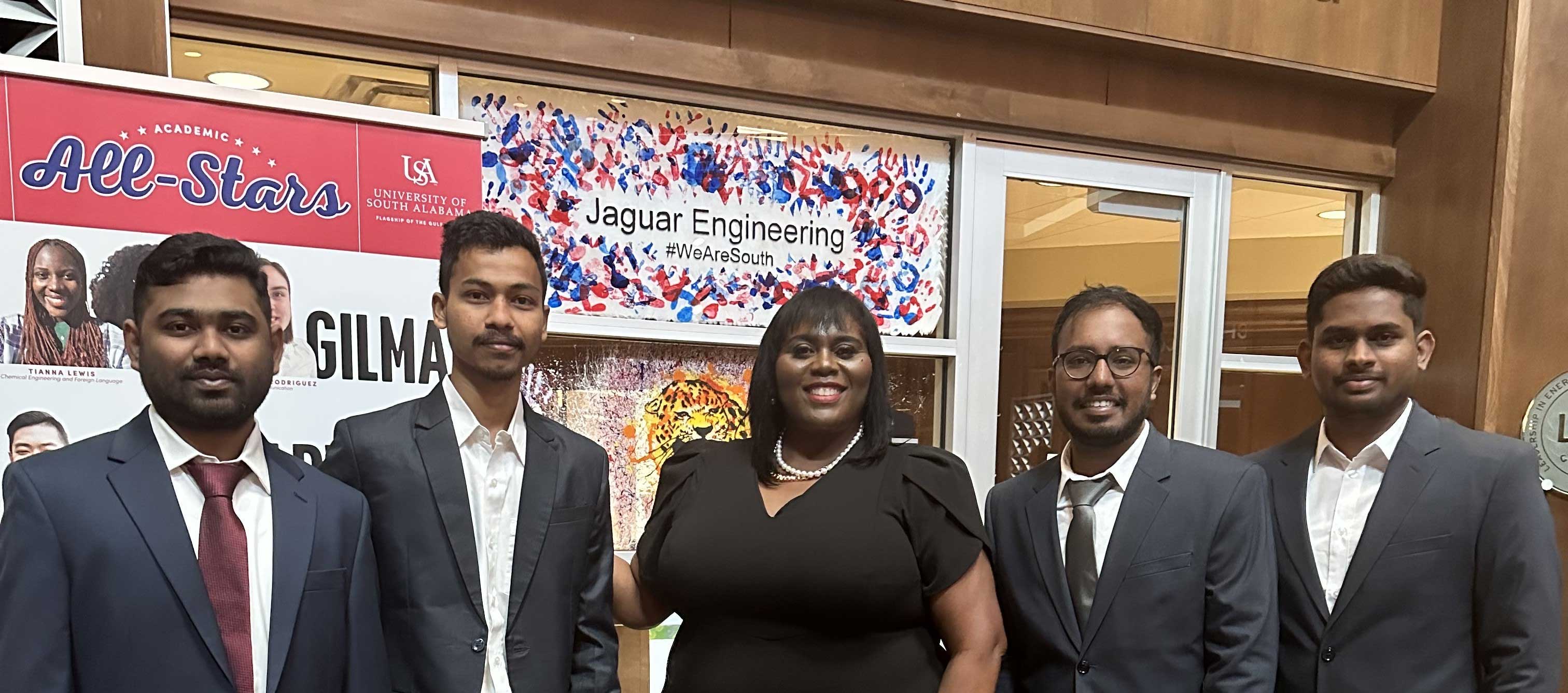 Dr. Lucas and group of students in front of the SoC office 