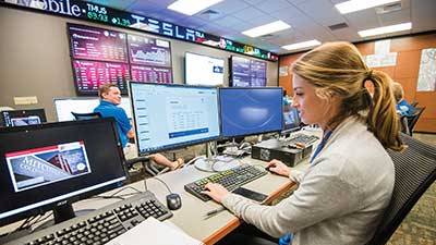 Female student working in Mitchell College of Business Lab.