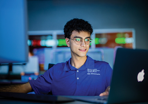 Student in Jaguar Investment Fund shirt