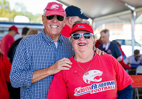 Alumni couple at tailgate event,