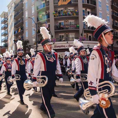 Jaguar Marching Band wearing beads