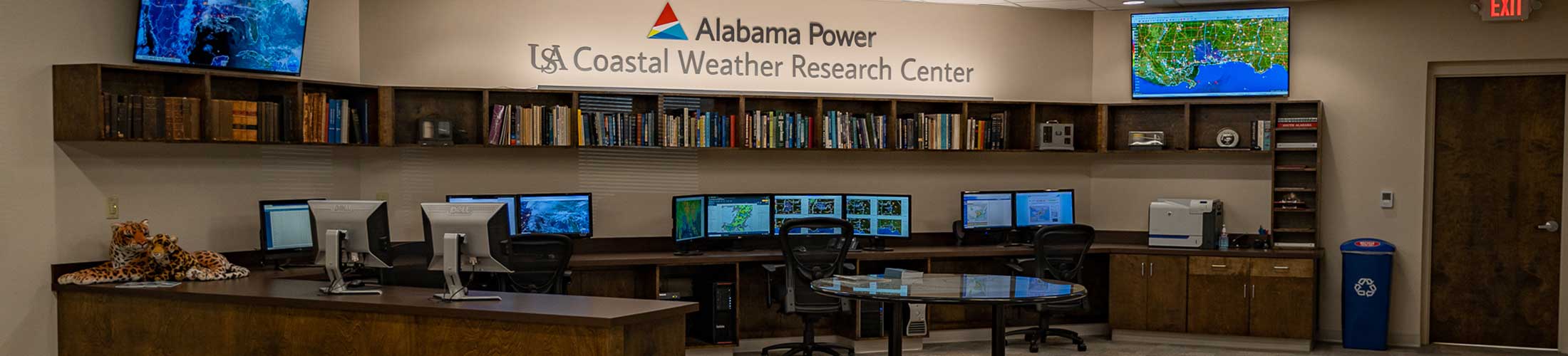 Alabama Power-USA Coastal Weather Research Center office displaying monitors.