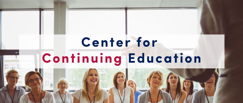 group of people standing together looking at the camera