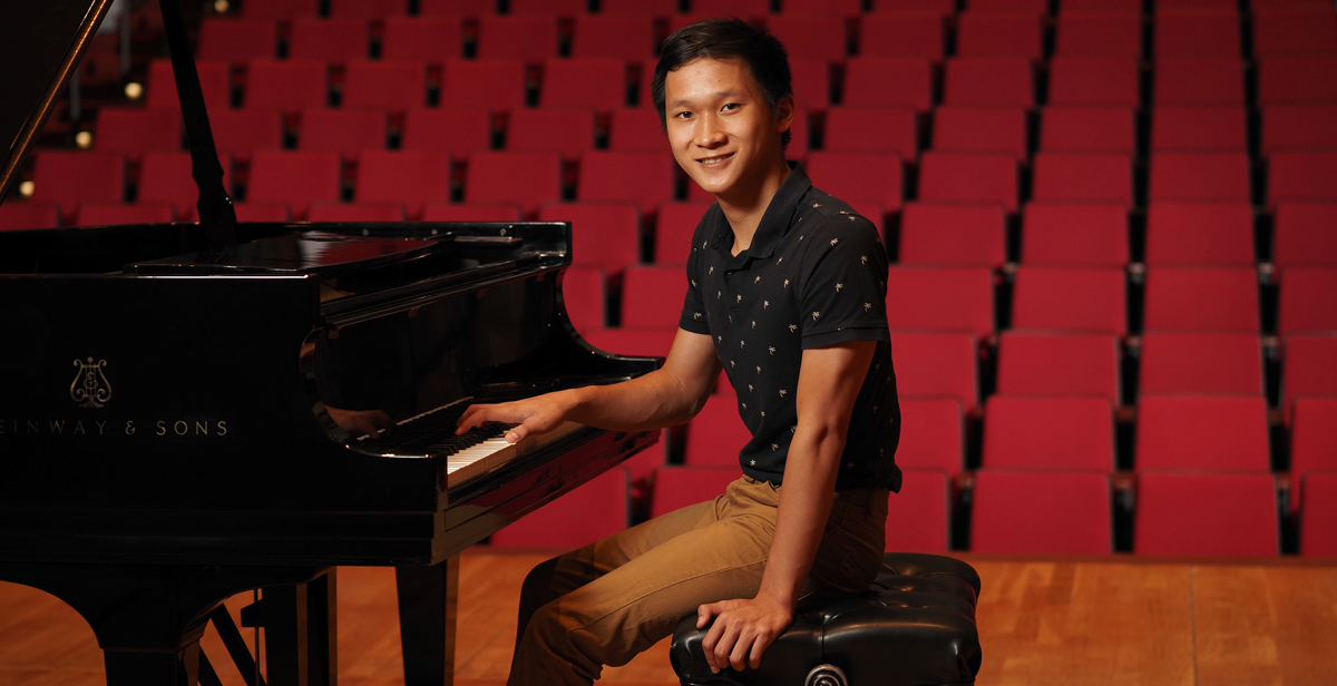 University of South Alabama student Paul Nguyen at a piano at Laidlaw Performing Arts Center on campus. data-lightbox='featured'
