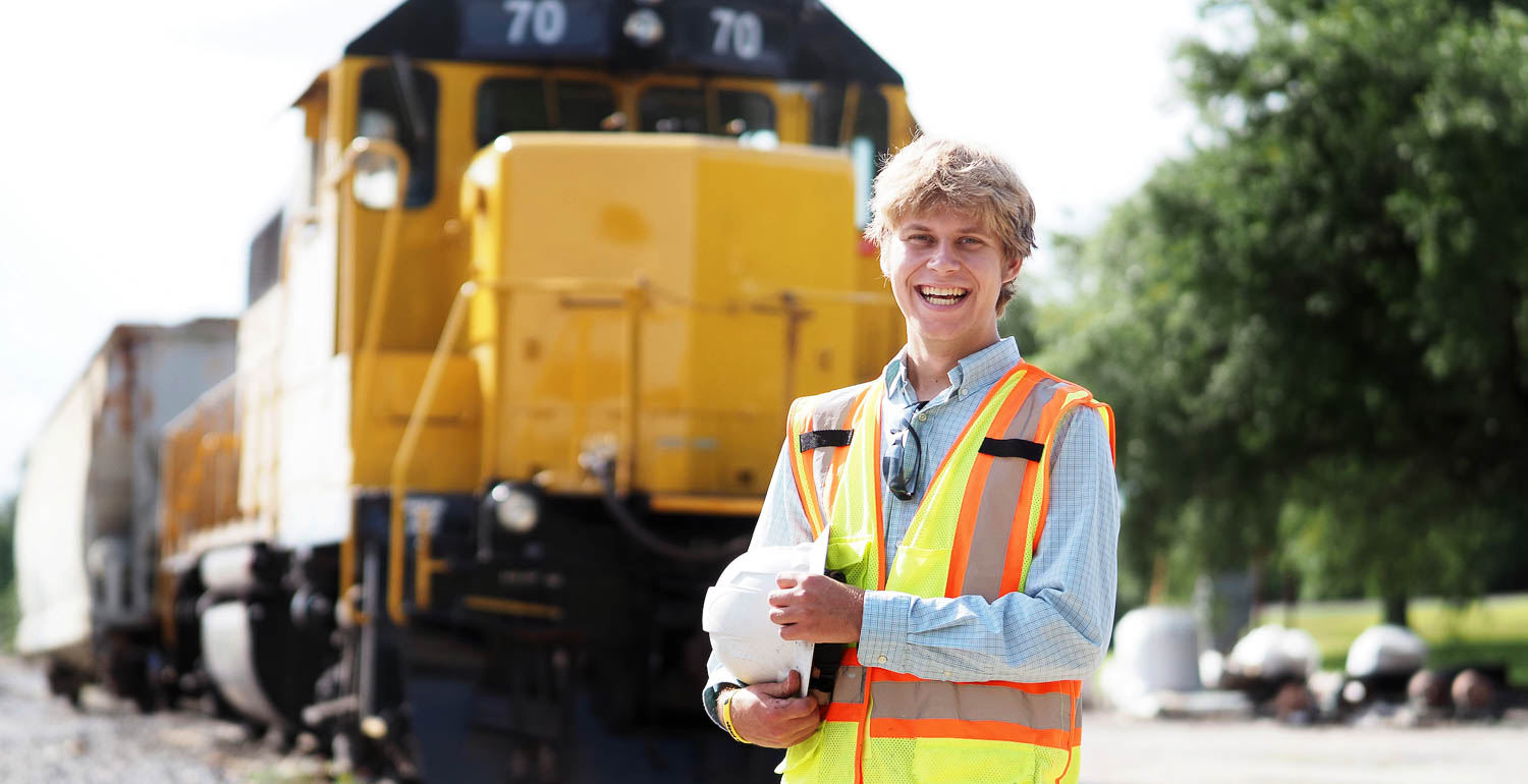 Luke Nelson with a train in the background. 