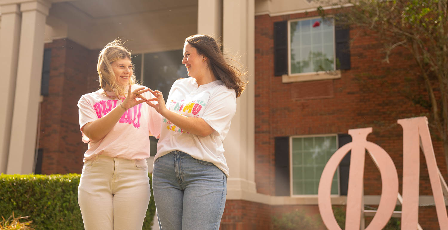 Marion McLaughlin, left, became the first PASSAGE USA student to pledge a Greek organization this fall. Her mentor, Carolina Lopez, right, is now also her big sister in the Phi Mu sorority. 

