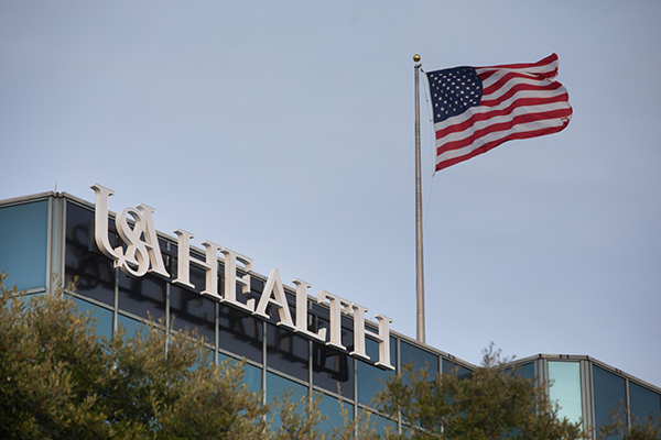 USA Health Hospital with American Flag.