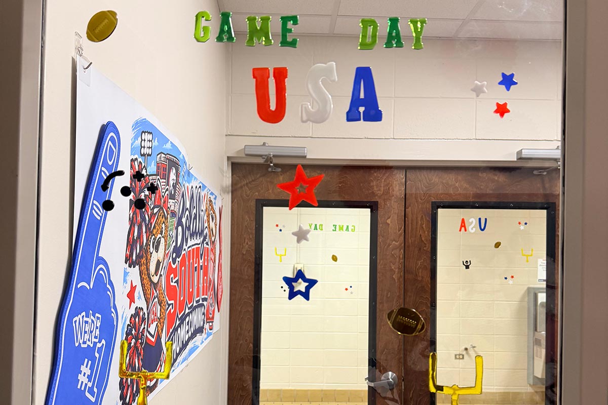 Hall and door decorated for Homecoming with sign, foam finger, and Game Day USA. Hall and door decorated for Homecoming with sign, foam finger, and Game Day USA.