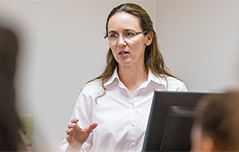 Dr. Forrester teaching in the classroom.